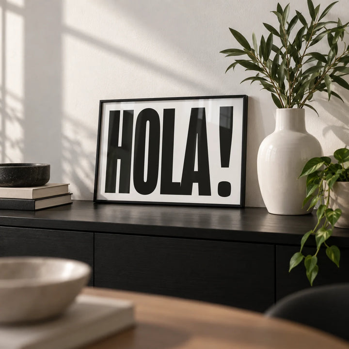 Typographic Posters, a small A4 framed print leaning on a black sideboard in a living room
