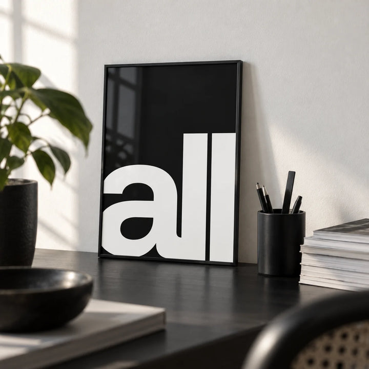 Typography Art Prints, a small A4 framed print leaning on a black desk