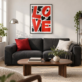 Typography Love Poster, framed on the wall of a design-led living room in a young couple's UK city flat with a white wall and pale timber floor