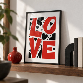Typography Love Poster, a small A4 framed print leaning on a walnut shelf in a living room