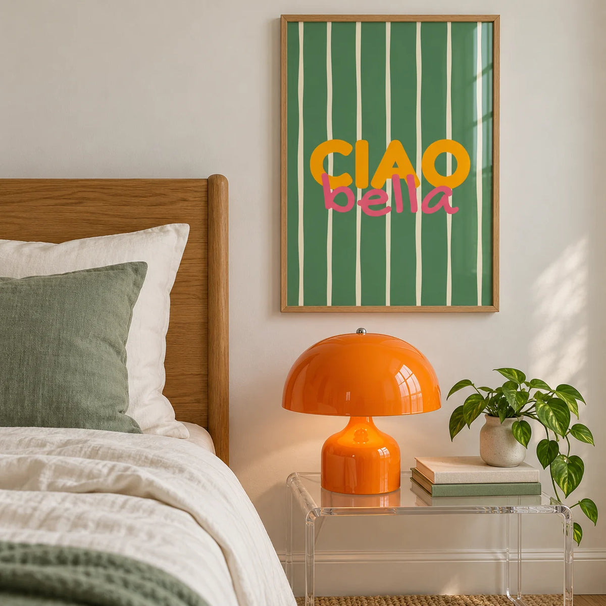 Typography Wall Art, framed on the wall of a bedroom with an orange bedside lamp