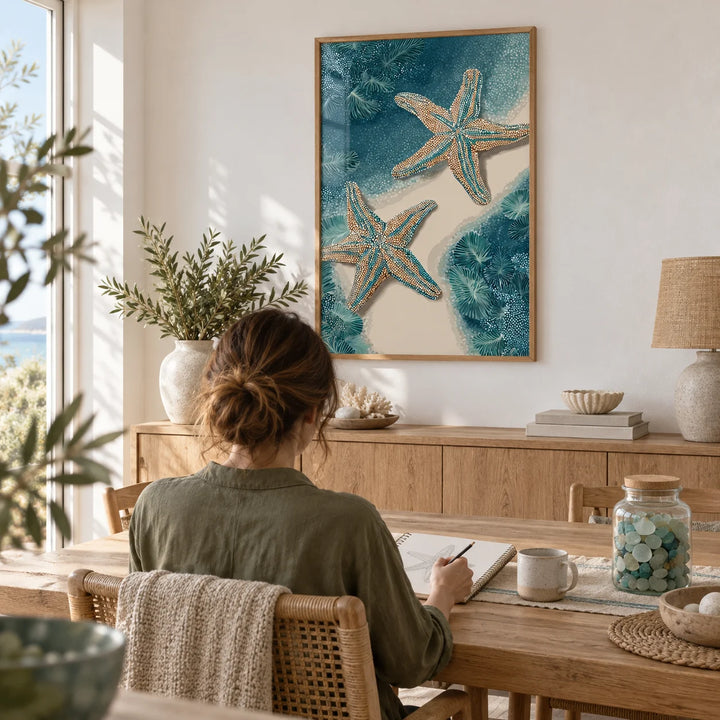 Underwater Starfish Print, framed on the wall of a bright coastal dining room with a white wall