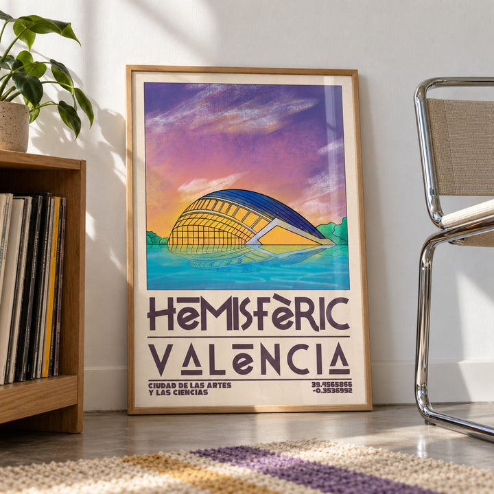 Valencia City Art Print shown in a living room, leaning on the floor by a chrome chair (frame not included)
