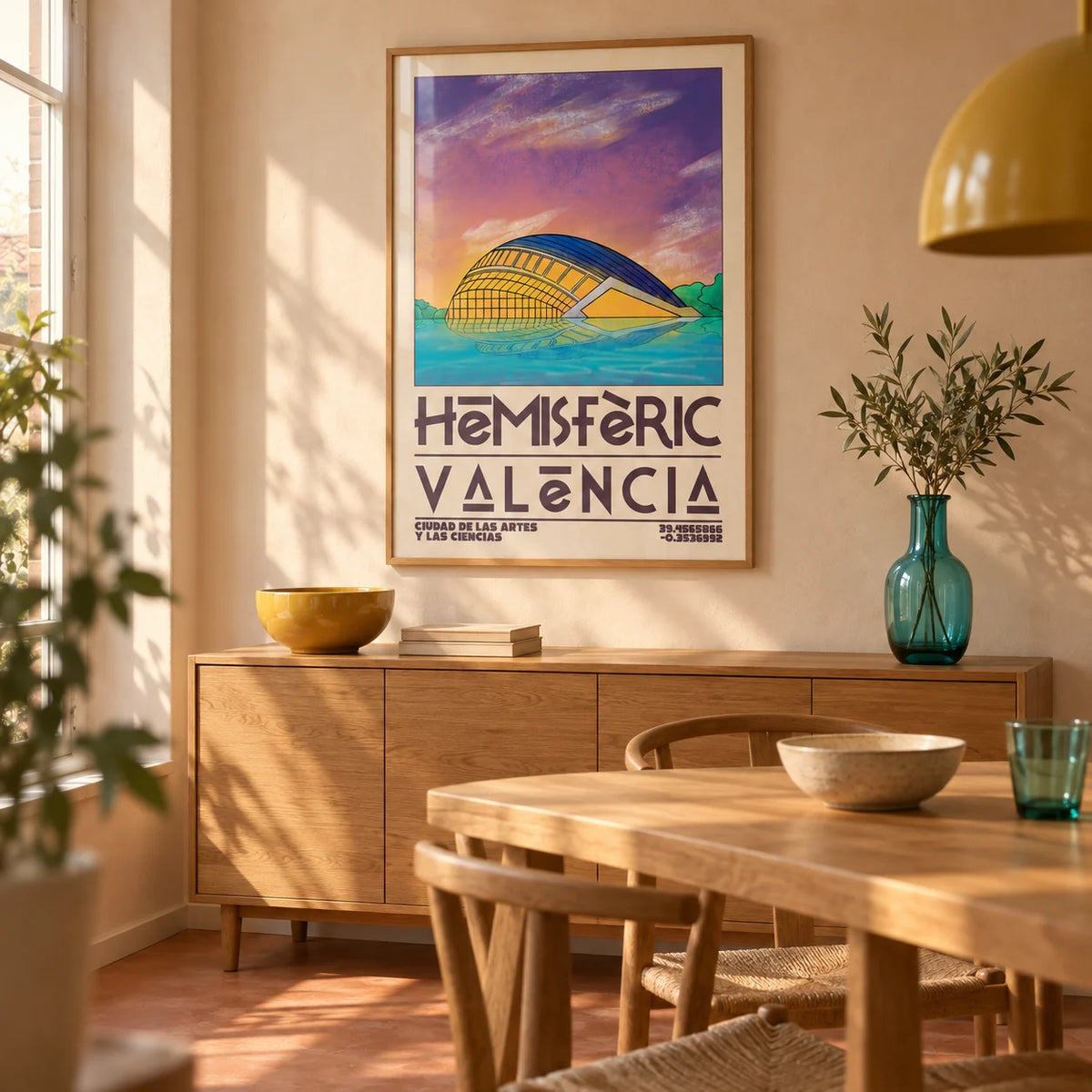 Valencia City Art Print, framed on the wall of a warm modern dining room in a UK terraced house with pale peach plaster walls and a plain terracotta floor