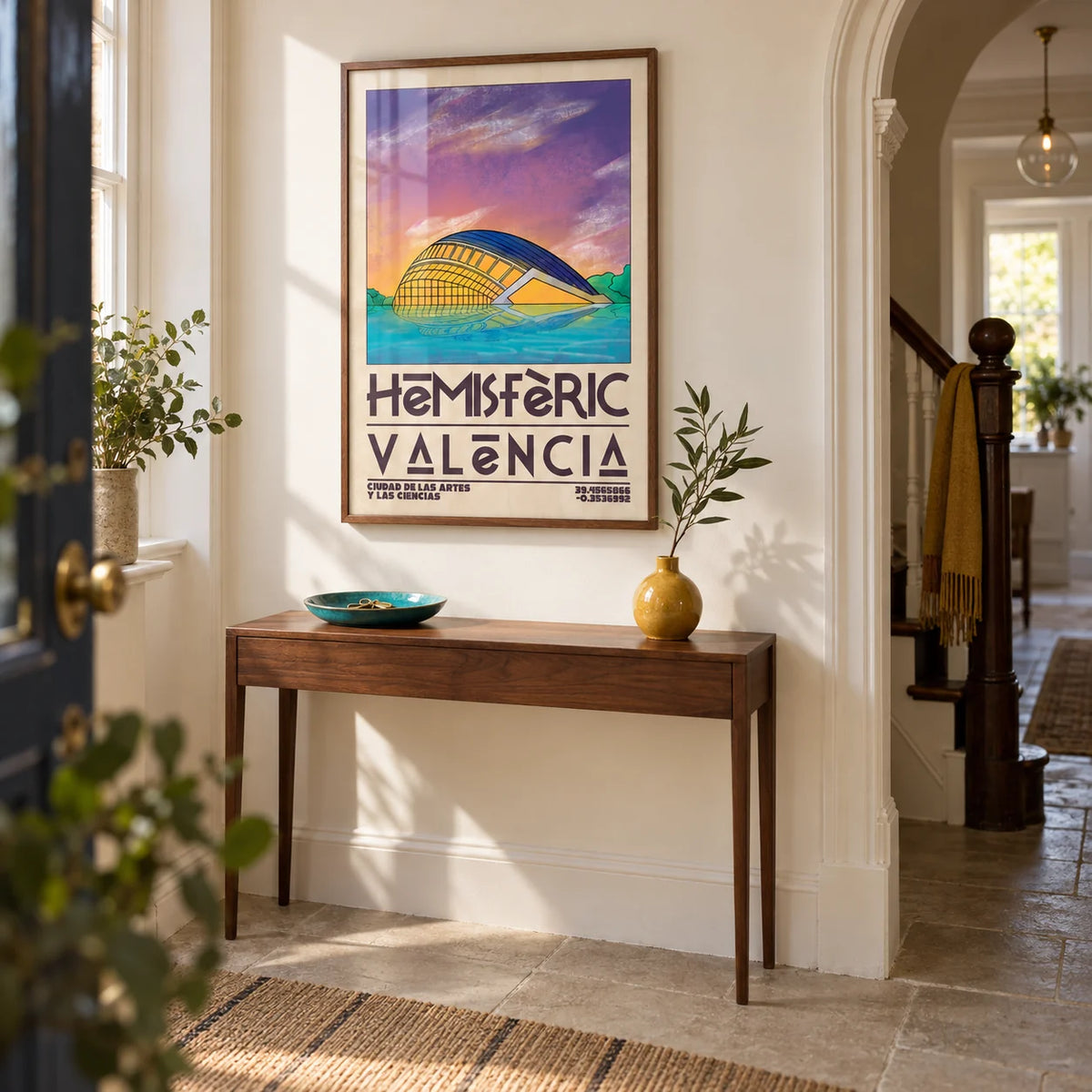 Valencia City Art Print, framed on the wall of a welcoming hallway in a UK Victorian terrace updated with smooth cream walls and a plain stone floor