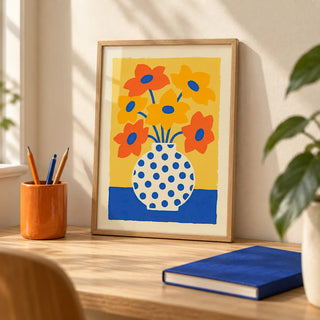 Vase and Flowers Poster, a small A4 framed print leaning on a pale oak desk