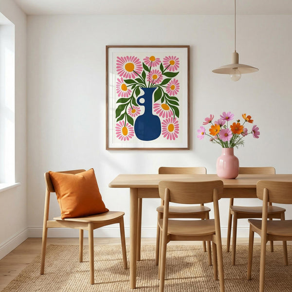 Dining room with wooden table and chairs, floral artwork on the wall, and a vase with flowers.