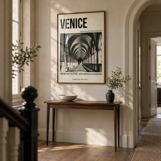 Venetian Gothic Wall Art, framed on the wall of a tall entrance hallway in a renovated UK period flat with pale stone walls and a simple arched doorway