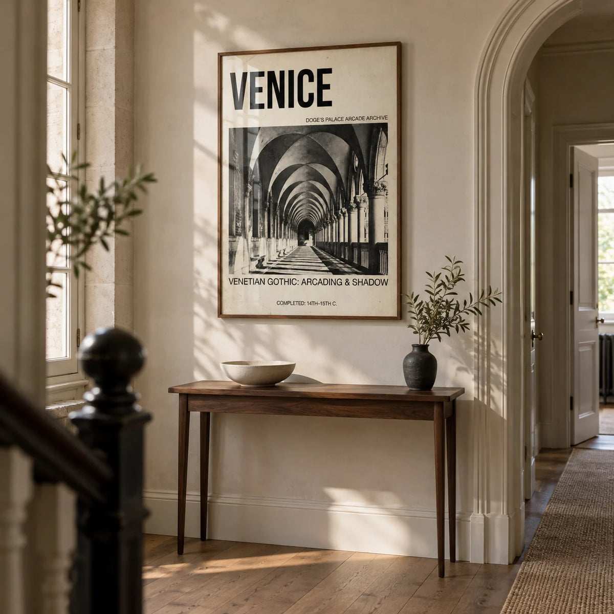Venetian Gothic Wall Art, framed on the wall of a tall entrance hallway in a renovated UK period flat with pale stone walls and a simple arched doorway