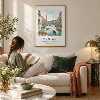 Venice Canal Art Print, framed on the wall of an elegant Italian-style living room with a warm white plaster wall and a parquet floor