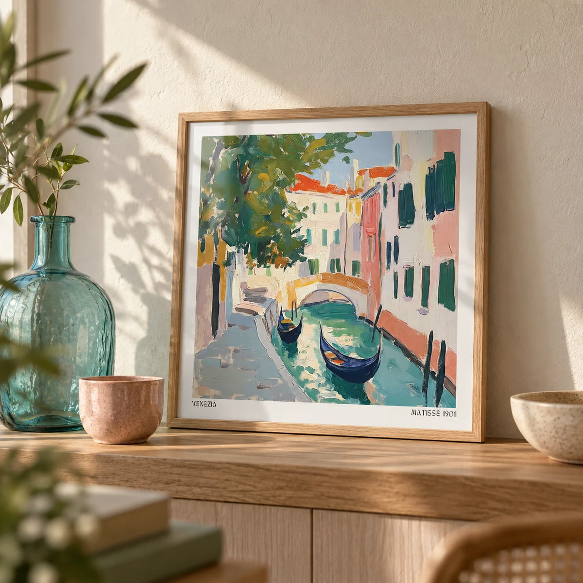 Venice Wall Art, a small A4 framed print leaning on an oak shelf in a living room