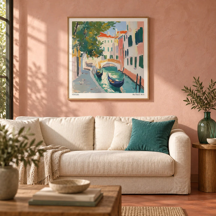Venice Wall Art, framed on the wall of a warm Italian-modern living room with a blush pink limewash wall and a plain terracotta floor