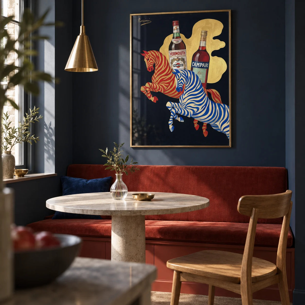 Vintage Beverage Art, framed on the wall of a compact dining nook in a renovated UK maisonette with a deep navy wall and a built-in plain rust-red banquette