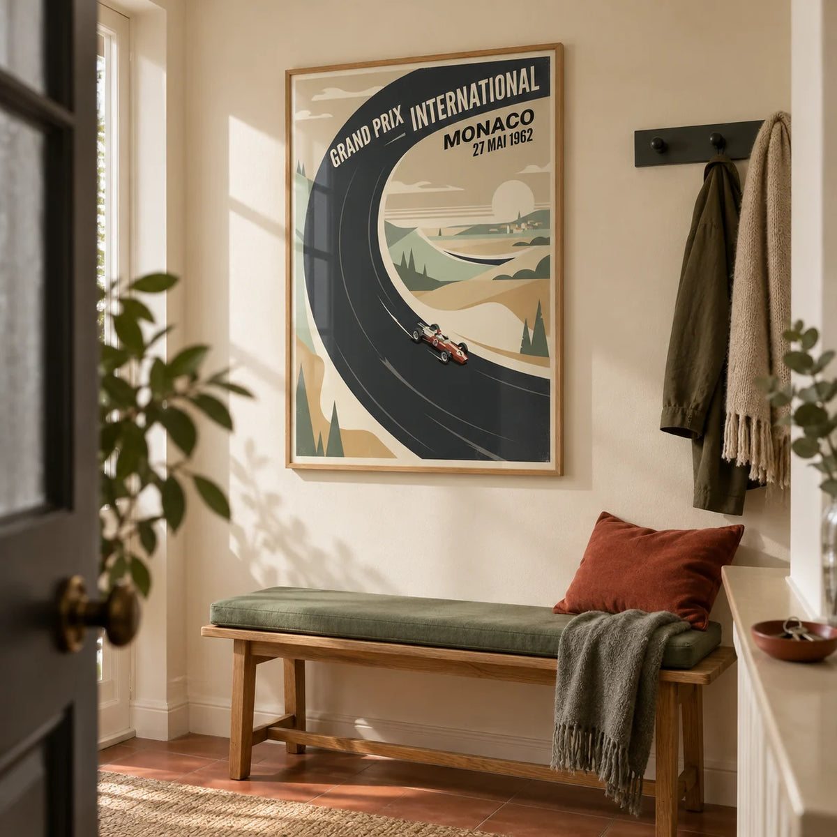 Vintage Car Racing Poster, framed on the wall of a welcoming hallway in a UK maisonette with warm cream walls and a plain terracotta floor