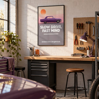 Vintage Car Wall Art, framed on the wall of a clean home garage workshop with a white painted brick wall