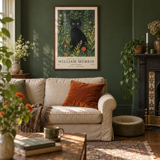 Vintage Cat Art, framed on the wall of a characterful Victorian terrace living room with a deep green painted wall and an original fireplace