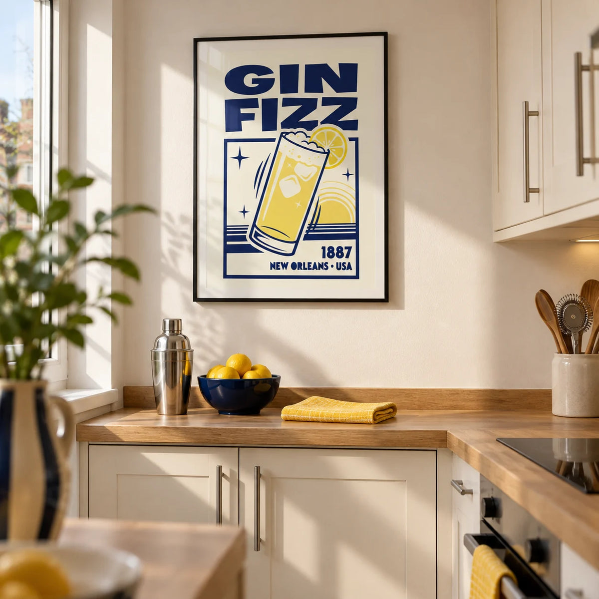 Vintage Gin Fizz Print, framed on the wall of a compact contemporary galley kitchen in a first UK flat for a cocktail-loving couple aged 25-35