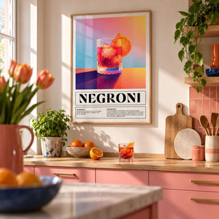 Vintage Italian Poster Art, framed on the wall of a colourful kitchen with pink cabinets