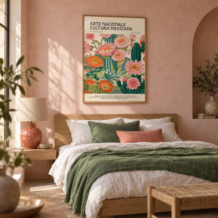 Vintage Mexican Poster, framed on the wall of a Mexican-modern bedroom with a soft pink limewashed wall and an arched niche