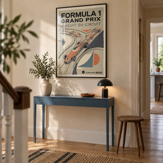Vintage Racing Poster, framed on the wall of a welcoming hallway in a renovated UK terrace with warm cream plaster walls and natural oak floorboards