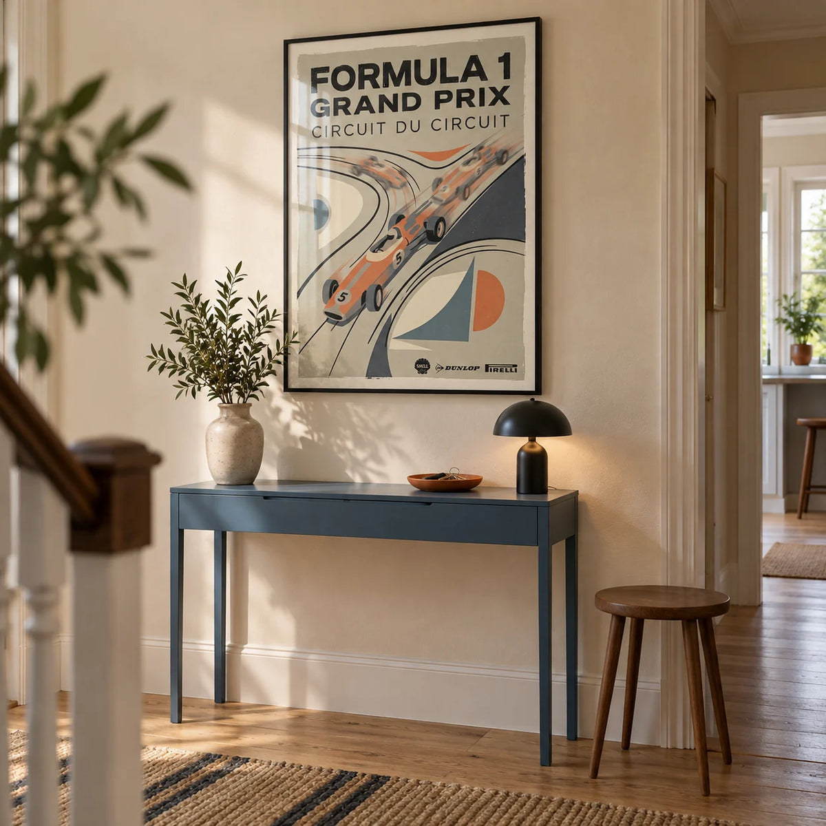 Vintage Racing Poster, framed on the wall of a welcoming hallway in a renovated UK terrace with warm cream plaster walls and natural oak floorboards