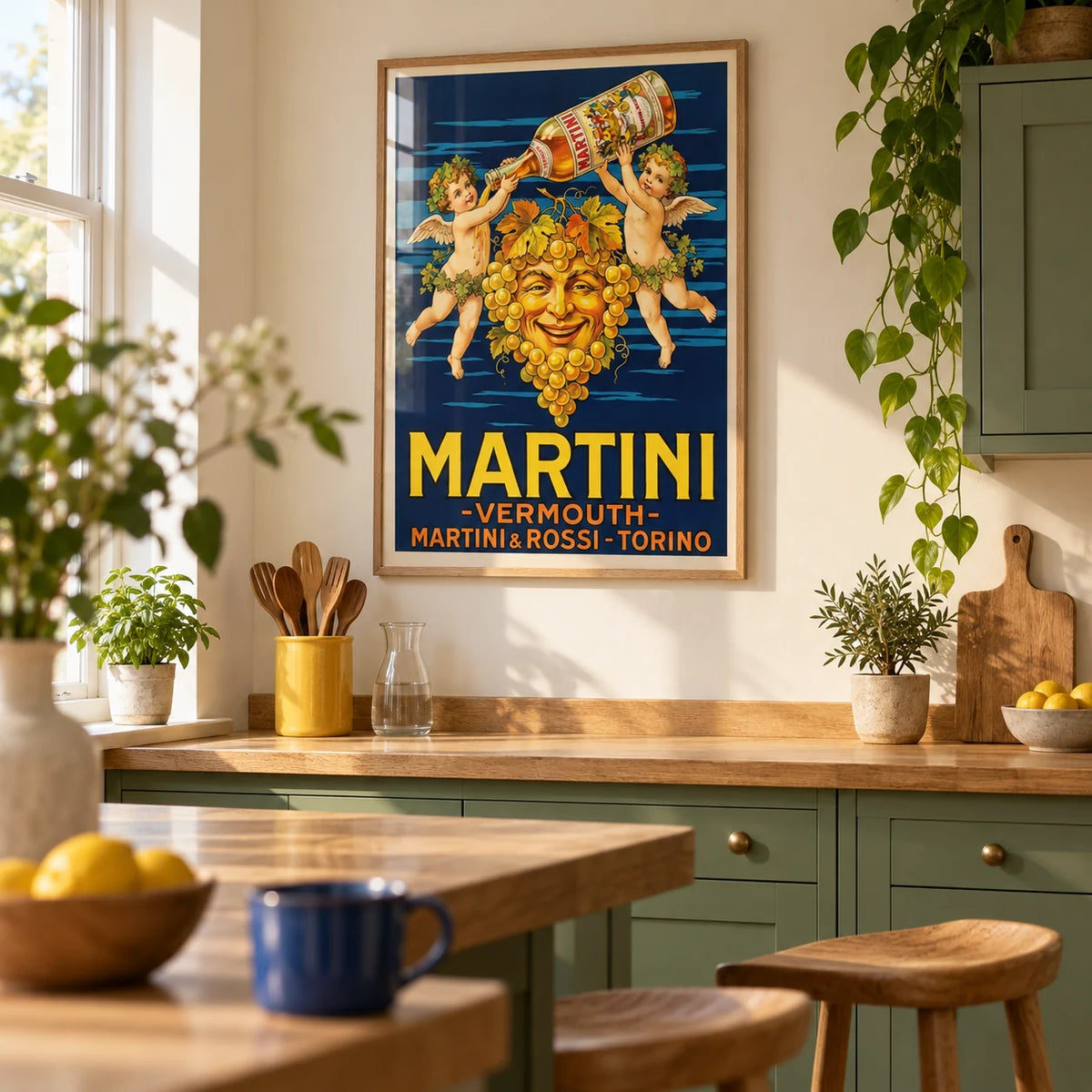 Vintage Vermouth Poster, framed on the wall of a welcoming kitchen in a renovated UK terrace with plain leaf-green cabinets