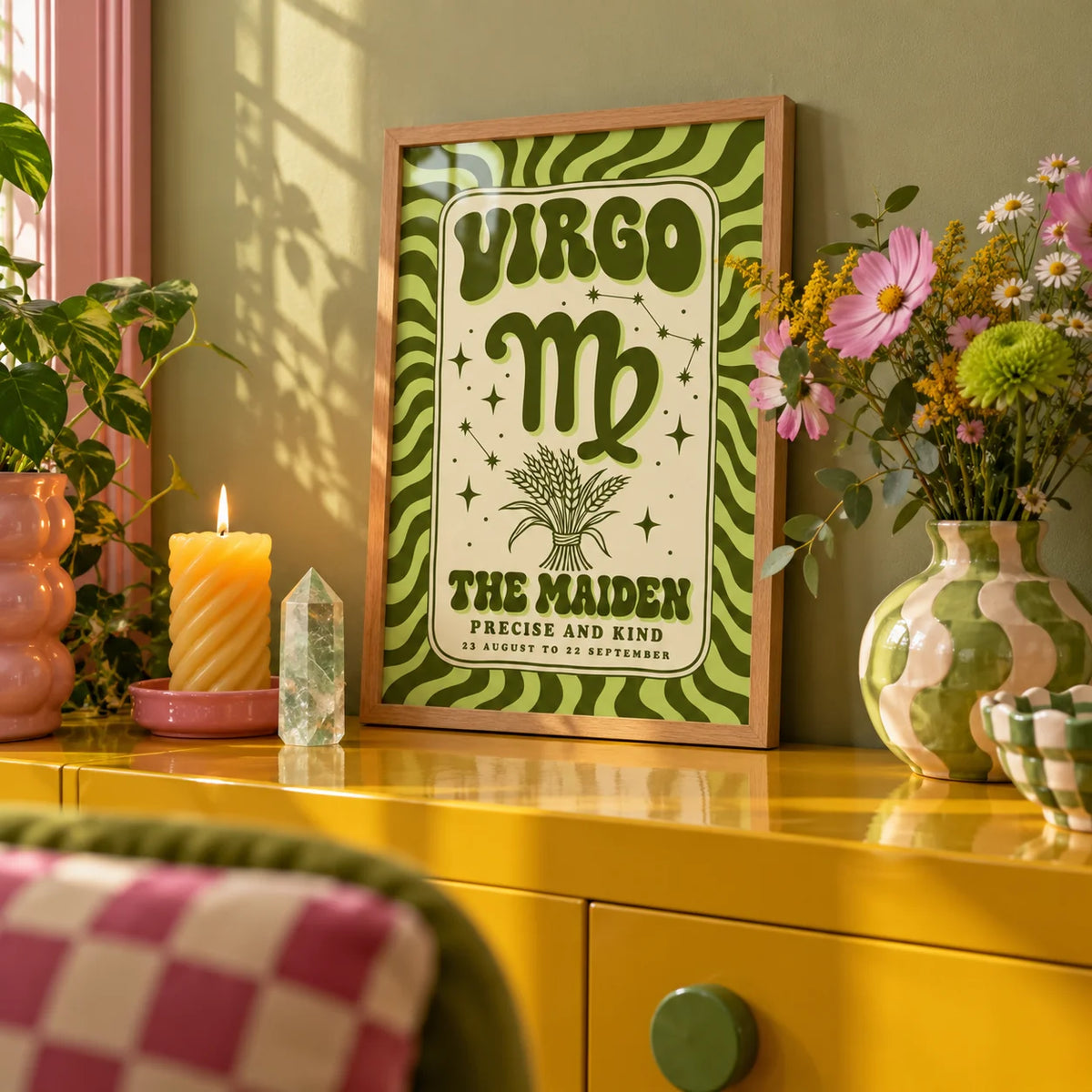Virgo Print, a small A4 framed print leaning on a colourful lacquered shelf in a living room