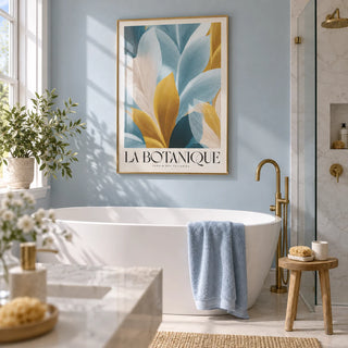 Wall Art Blue and Gold, framed on the wall of a bright white bathroom with a pale blue painted wall and a walk-in shower screen