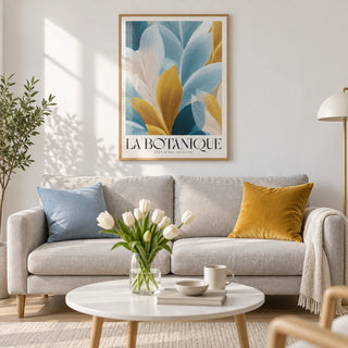 Wall Art Blue and Gold, framed on the wall of a light Scandi living room with a white wall and a pale oak floor