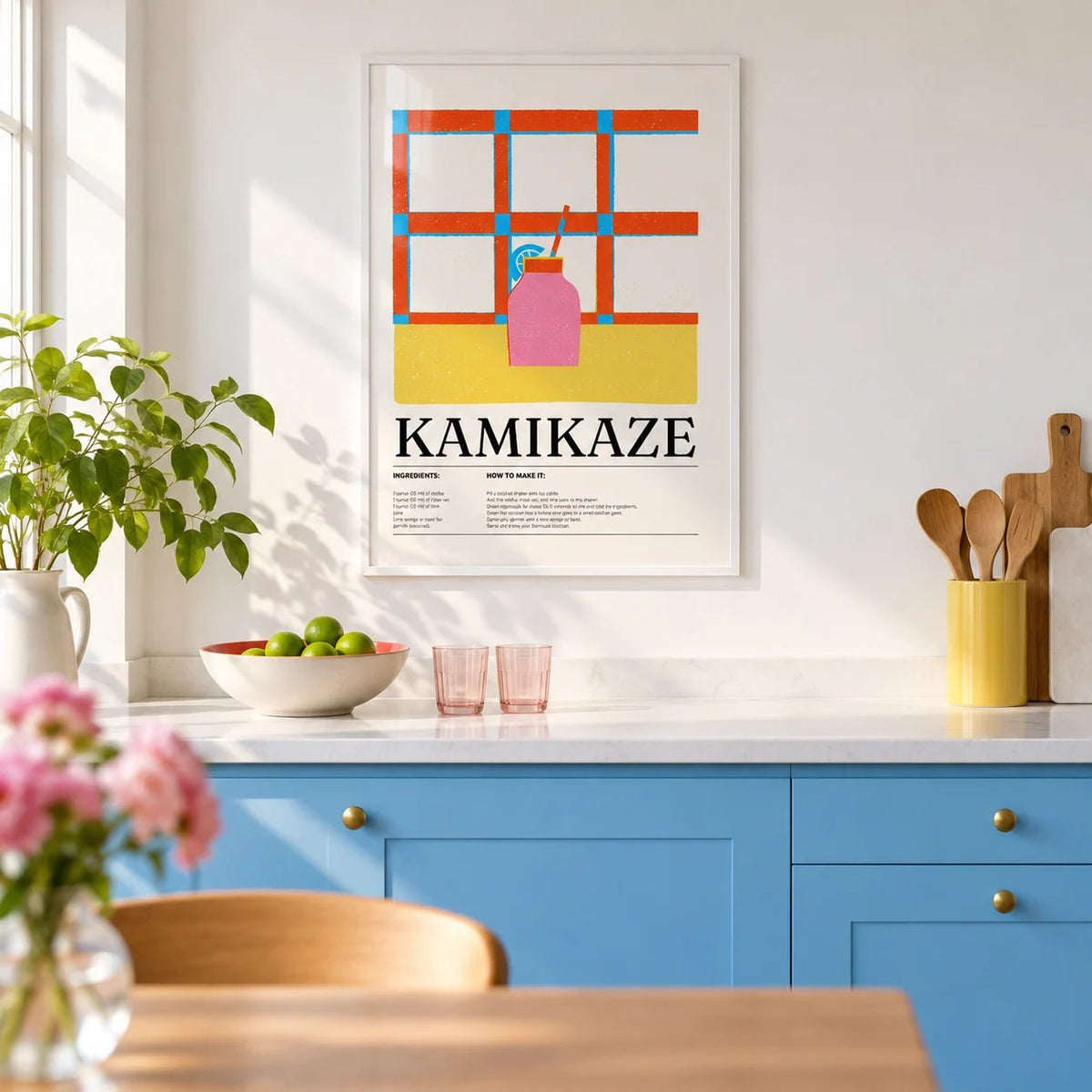 Wall Art Drink, framed on the wall of a bright kitchen with plain sky blue painted cabinets and a white worktop