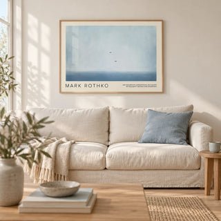 Wall Art Light Blue, framed on the wall of a calm coastal living room with a warm white wall and a pale oak floor