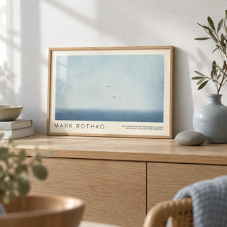 Wall Art Light Blue, a small A4 framed print leaning on a pale oak sideboard in a living room