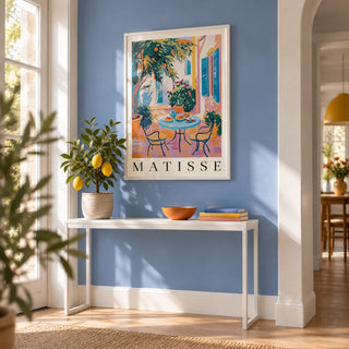 Wall Art Mediterranean, framed on the wall of a bright hallway with a pale cobalt blue painted wall