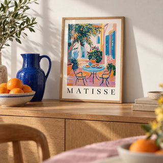 Wall Art Mediterranean, a small A4 framed print leaning on an oak sideboard in a living room