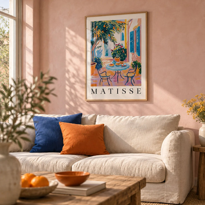 Wall Art Mediterranean, framed on the wall of a sunny living room with a soft pink limewashed wall