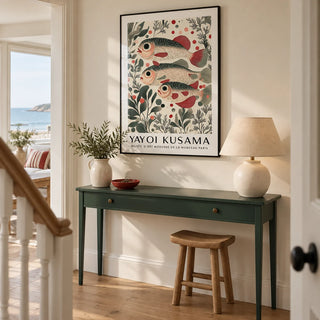 Wall Art of Fish, framed on the wall of a welcoming hallway in a contemporary UK seaside home with a pale cream wall and oak floorboards