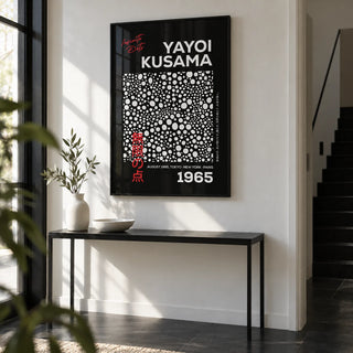 Wall Art Polka Dots, framed on the wall of a modern hallway with a white wall and a black floor