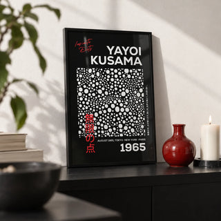 Wall Art Polka Dots, a small A4 framed print leaning on a black shelf in a living room