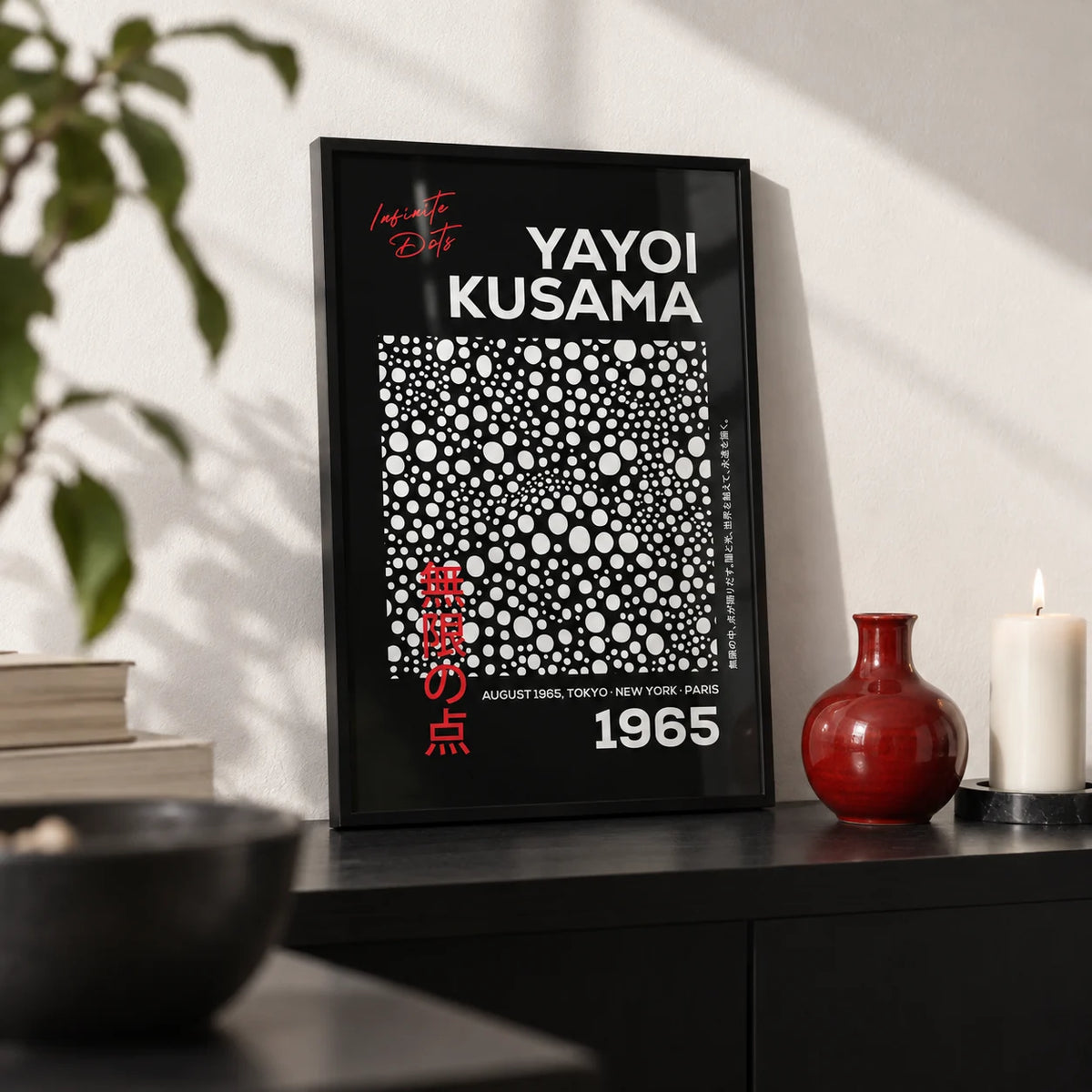 Wall Art Polka Dots, a small A4 framed print leaning on a black shelf in a living room