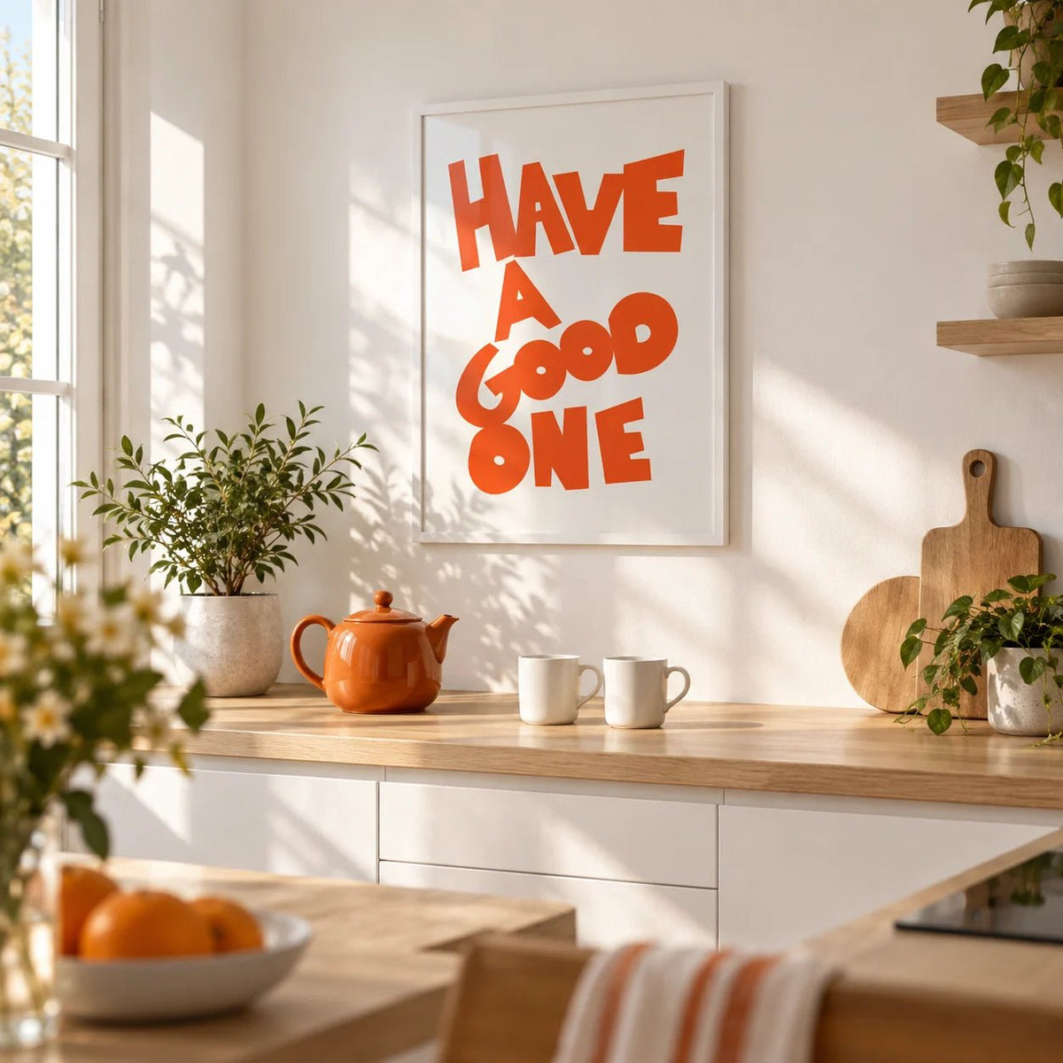Wall Art Typography, framed on the wall of a modern white kitchen with a pale oak worktop