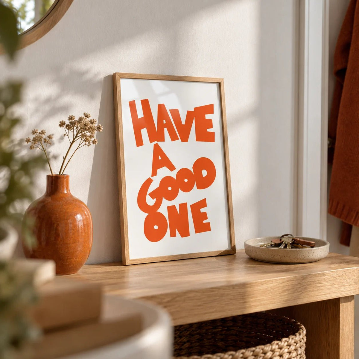 Wall Art Typography, a small A4 framed print leaning on an oak hallway shelf