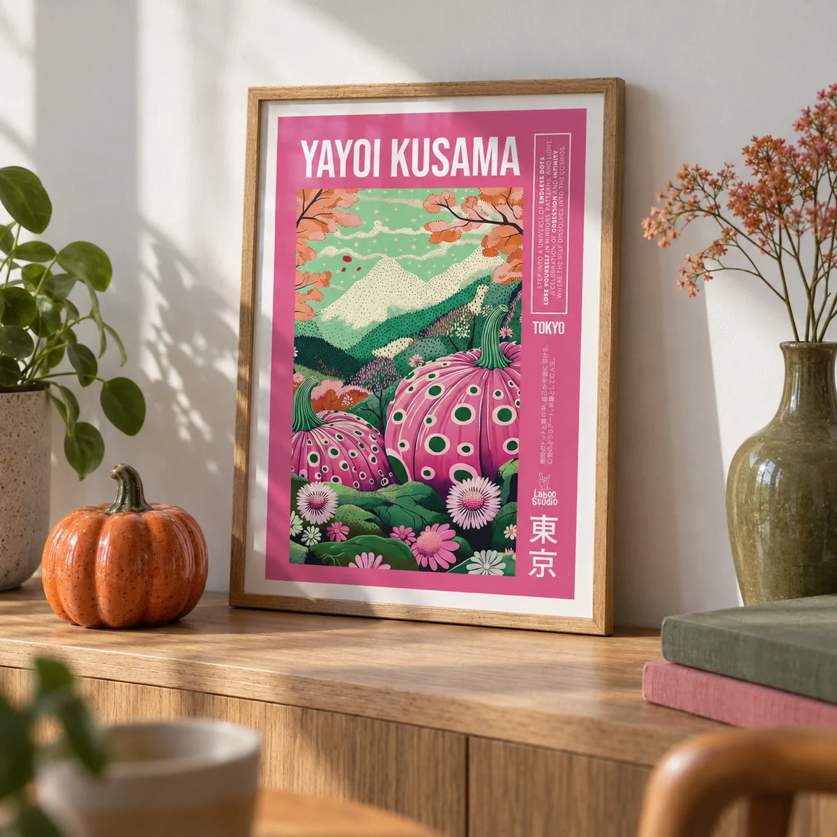 Wall Art with Pink, a small A4 framed print leaning on an oak shelf in a living room