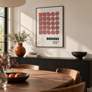 Wall Hanging Geometric, framed on the wall of a modern dining room with a warm white wall