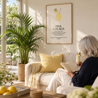 Wall Pictures for Kitchen, framed on the wall of a bright garden room with glass doors and a warm white wall in a living room