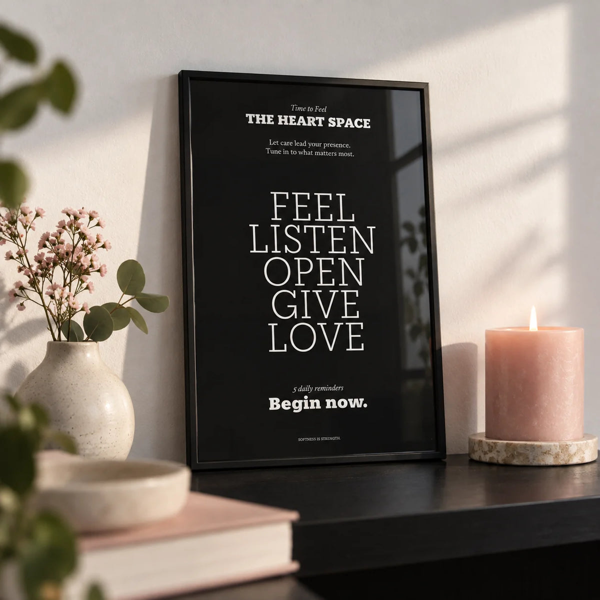 Wall Quotes for Bedroom, a small A4 framed print leaning on a black shelf in a living room