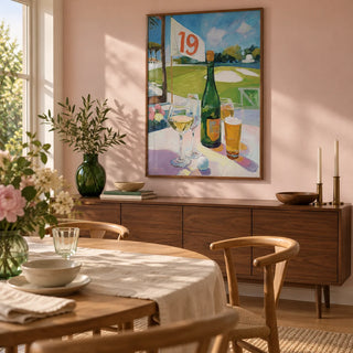 Watering Hole Golf Art Print, framed on the wall of a relaxed dining room in a golf-loving couple's UK home with a pale pink wall and oak floorboards
