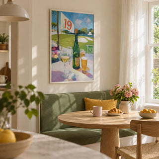 Watering Hole Golf Art Print, framed on the wall of a sunny kitchen breakfast nook in a UK garden flat with cream walls and a built-in banquette upholstered in solid muted green