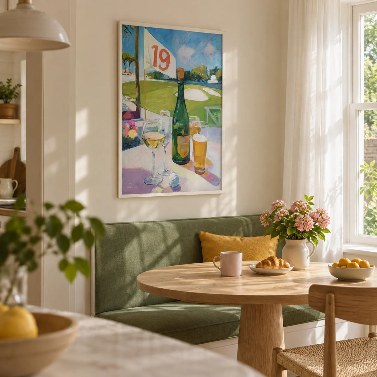 Watering Hole Golf Art Print, framed on the wall of a sunny kitchen breakfast nook in a UK garden flat with cream walls and a built-in banquette upholstered in solid muted green