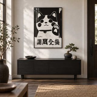 Waving Maneki Neko, framed on the wall of a Japandi entrance hall by the front door with a white plaster wall and a dark oak floor