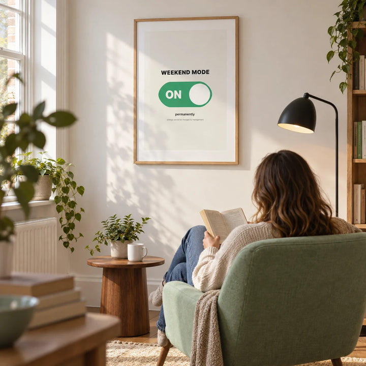 Weekend Poster, framed on the wall of a bright reading corner in a modern UK terrace with a warm white wall in a living room